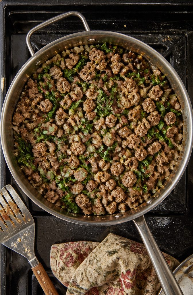 Stuffed Squash Recipe - How to Make Stuffed Squash (2026) 3 A skillet with browned sausage and sautéed vegetables.
